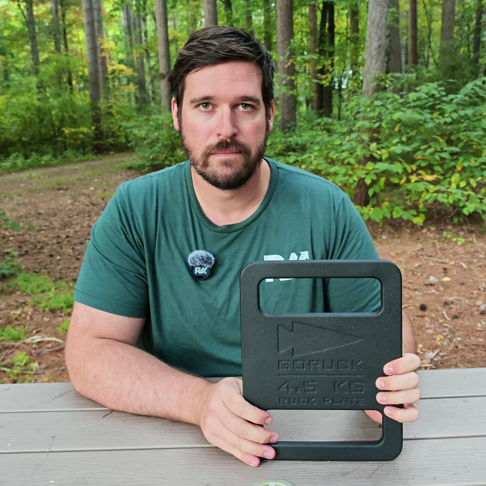 Joel Kelly holding his 10 lb Standard Ruck Plate