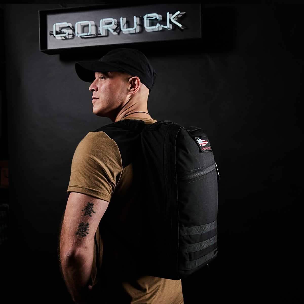 Person wearing a black GORUCK Bullet Ruck 16L