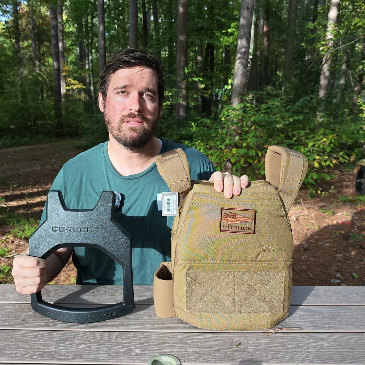 My Coyote Brown vest beside a bare Curved plate at a picnic table