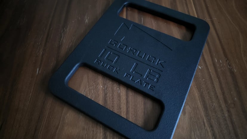 GORUCK 10 lb Standard Ruck Plate lying on a wooden table