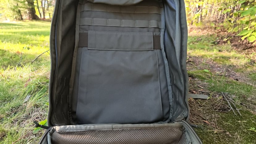 Inside the GR1 main compartment: the plate sleeve against the back panel, with its hook-and-loop strap and webbing rows above