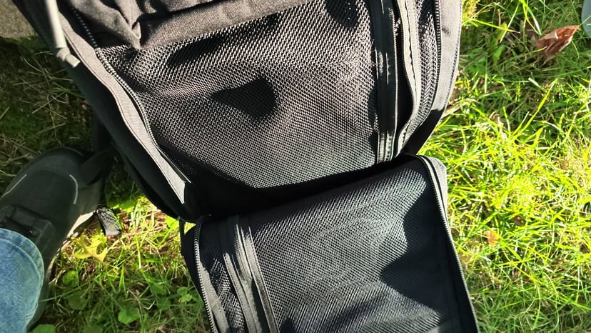 The GR2's front compartment unzipped flat, showing its mesh organizer pockets