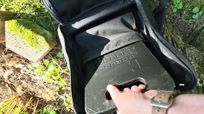 Sliding a GORUCK plate into the GR2's back-panel sleeve