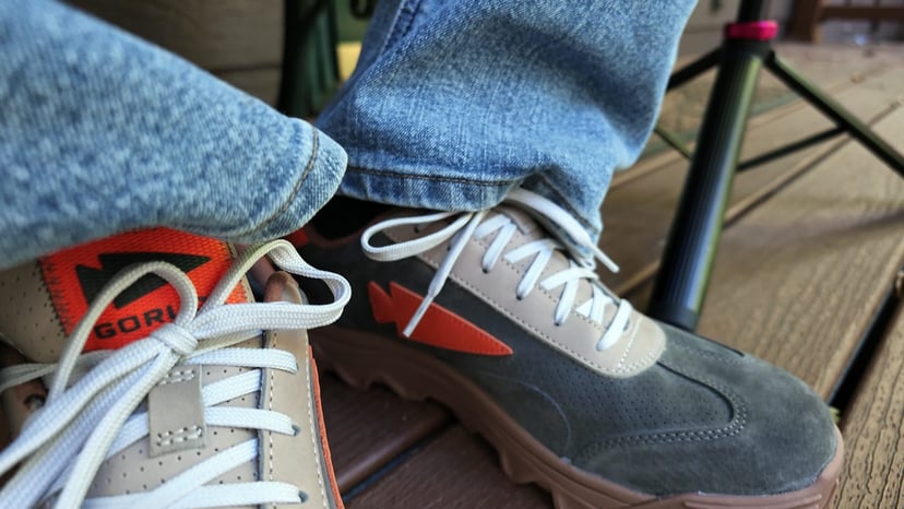 The Mackall 45 in Fog worn with jeans on a wooden deck