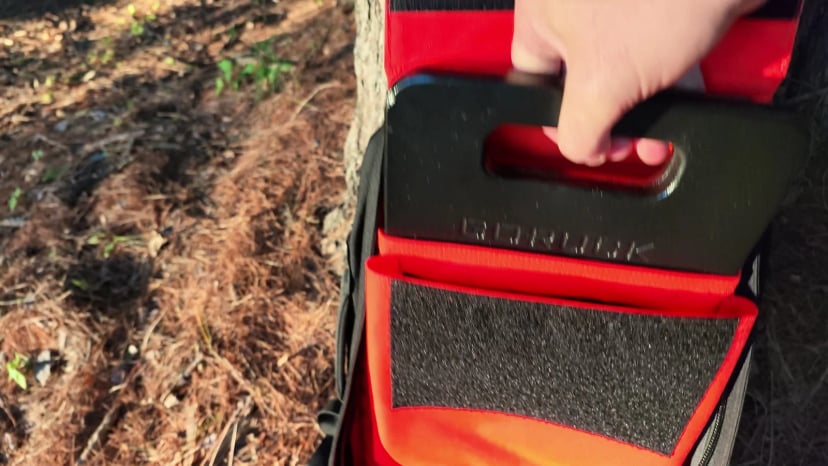A 20 lb plate being lowered into the elevated Rucker 5.0 plate pocket