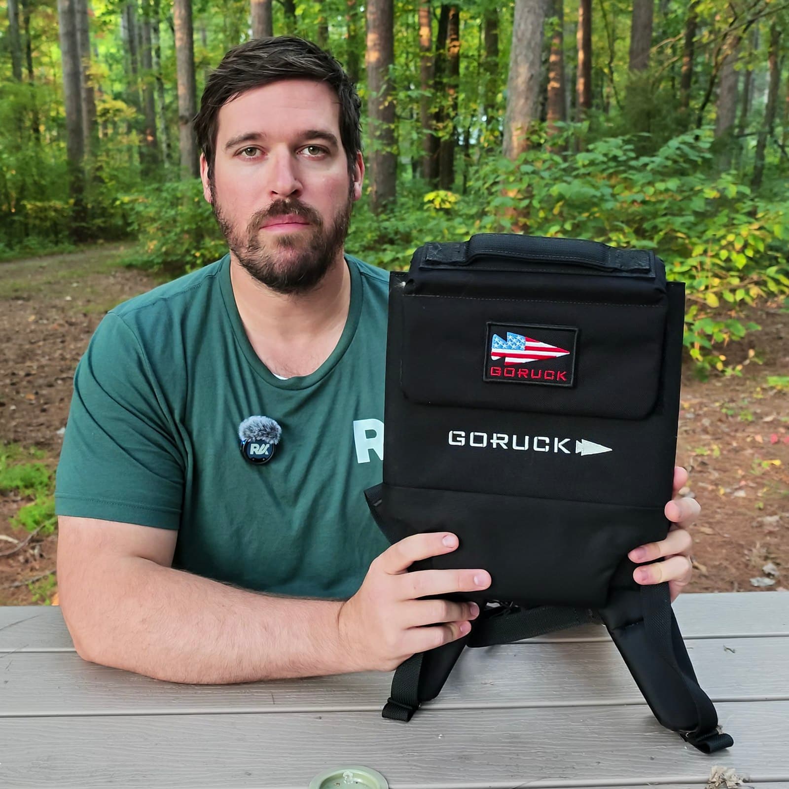 Joel Kelly holding his black GORUCK Ruck Plate Carrier 3.0