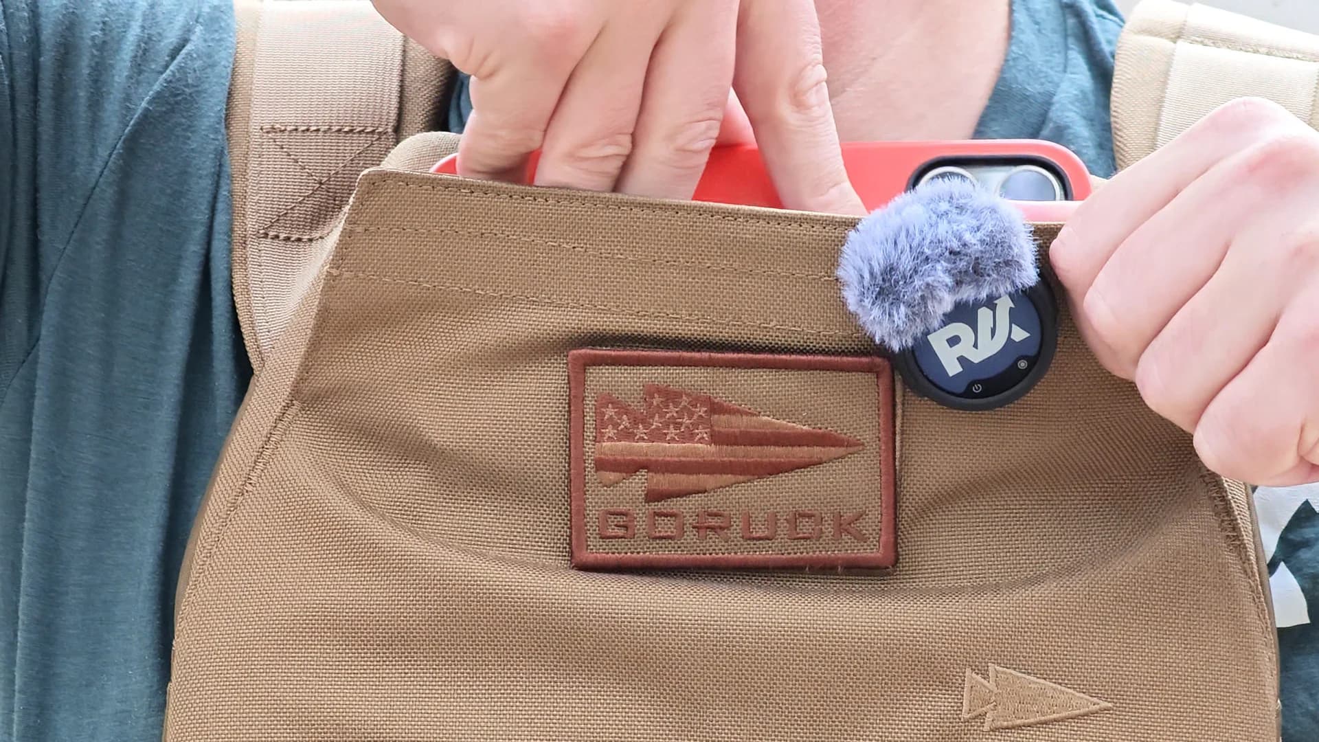 My iPhone Pro Max sliding into the magnetic chest pocket